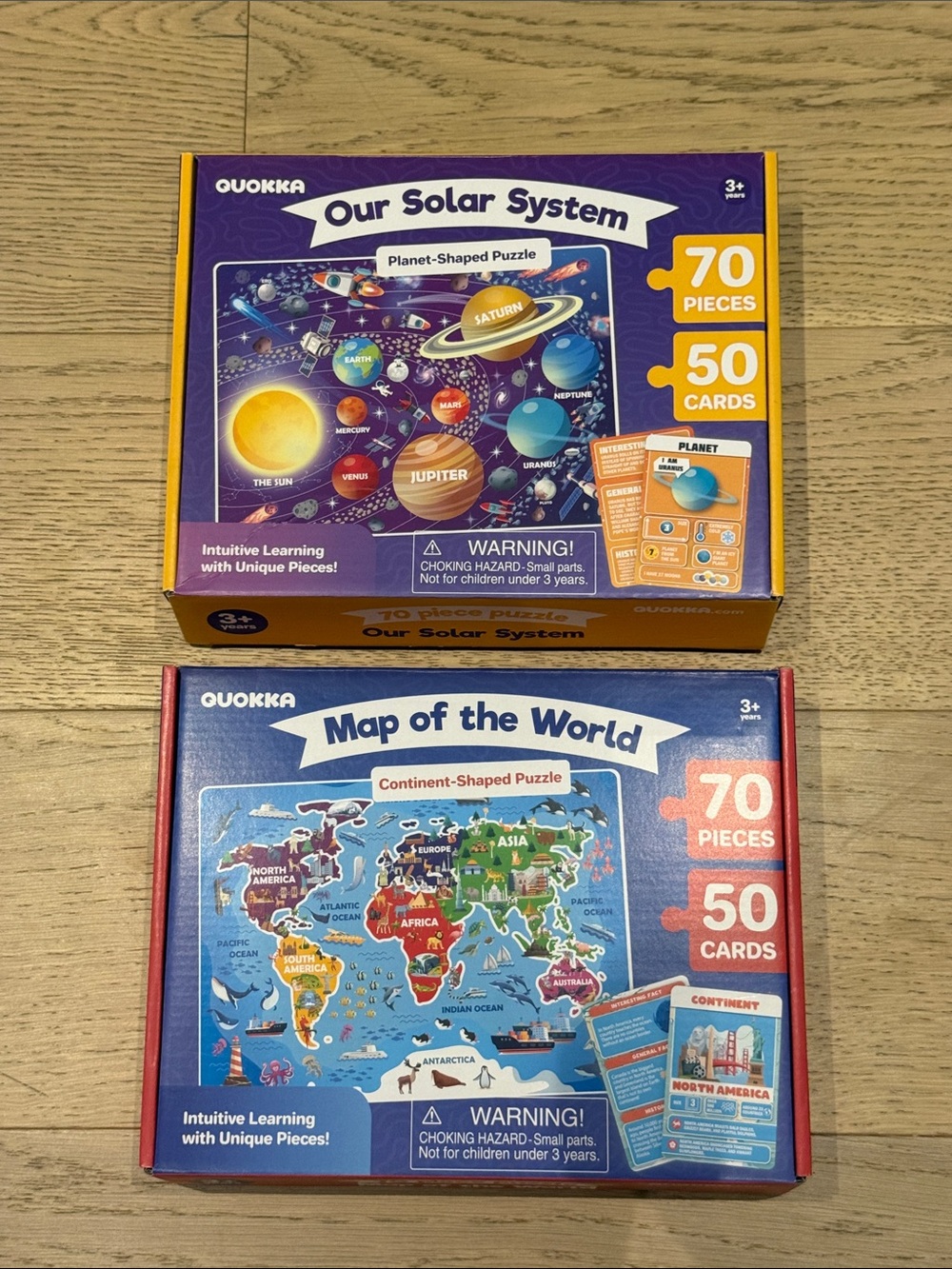 Lot of 2 - 70 piece puzzles with information cards